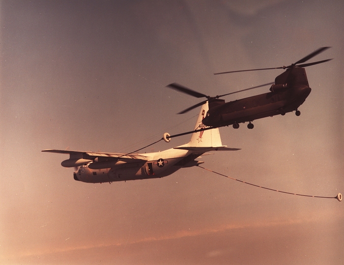 A photograph of an MH-47D Chinook helicopter conducting air to air refueling operations