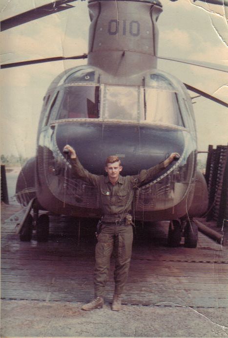 SP5 Gary J. Stefanini standing at the nose of CH-47A 66-19010, circa 1968.