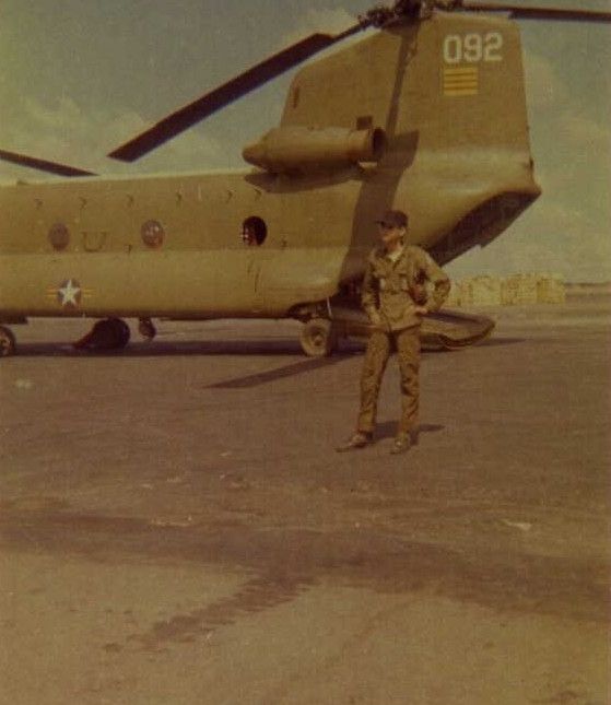An undated photograph of CH-47A Chinook helicopter 66-19092 at an unknown location in the Republic of Vietnam. An unknown Soldier stands by the aircraft.
