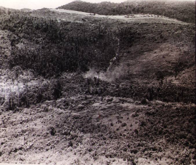Another CH-47 can be seen in this photograph parked to the left of Fire Support Base (FSB) Mary Ann on the hill above the still smoking crash site of 69-17120.