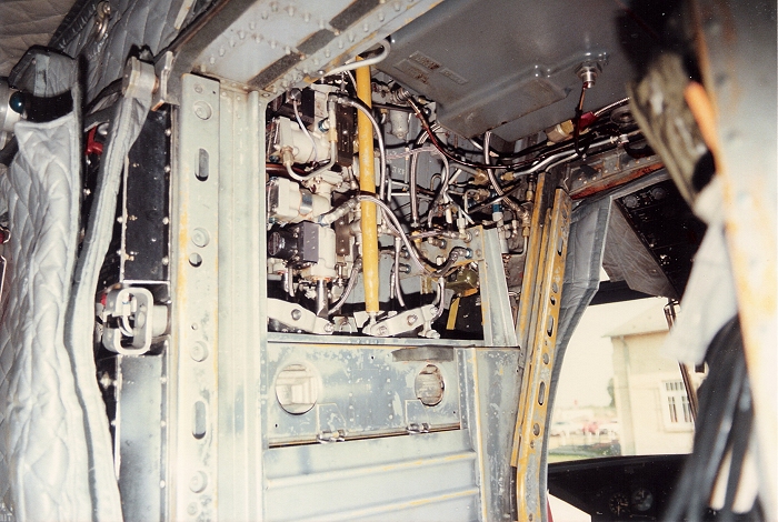 The upper Flight Control Closet of CH-47C Chinook helicopter 70-15032. One can see a portion of the Pitch Stability Augumentation System (PSAS) Control Box mounted on the Station 120 bulkhead aft of the Flight Control closet.