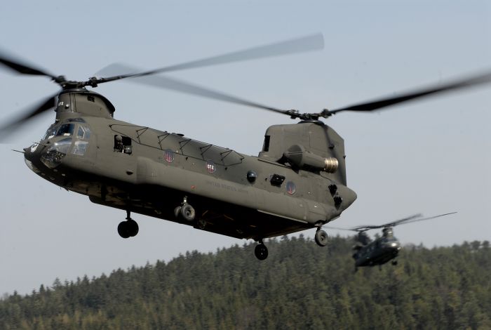 CH-47D Chinook helicopter 87-00072 in an unknown location on an unknown date flying in formation with a sister ship from "Big Windy", formerly the 180th Aviation Company located in Germany.