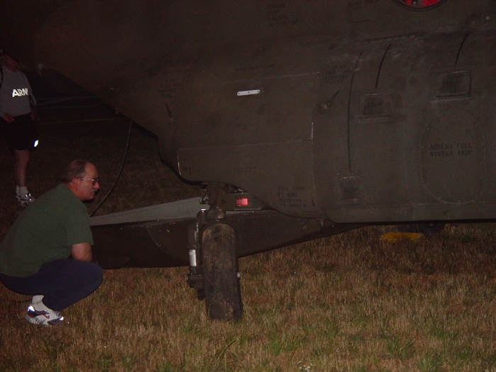 6 July 2002: An unknown individual examines the aft landing gear of 89-00138.