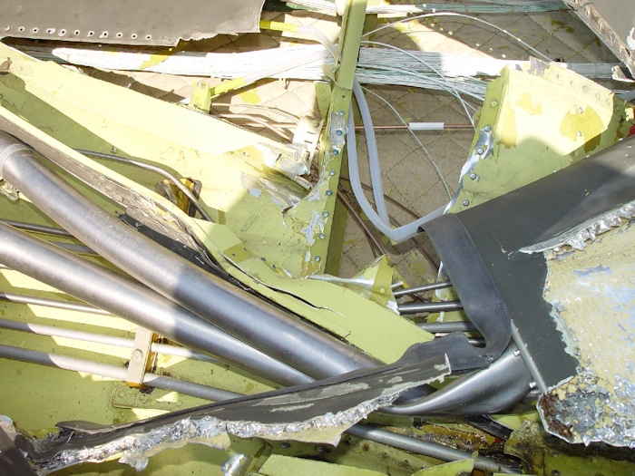 July 2002: A closer view of the severely damaged flight control tubes.