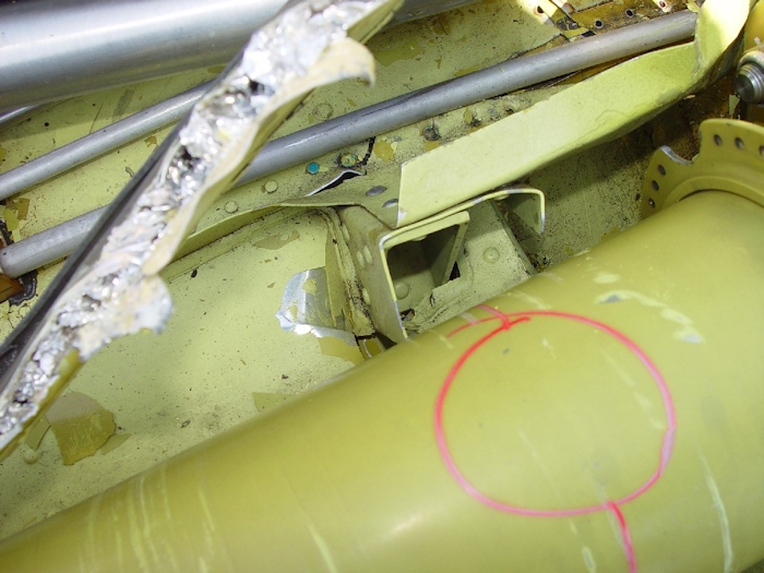 July 2002: A view of the sheet metal damage just aft of the number two hanger bearing.