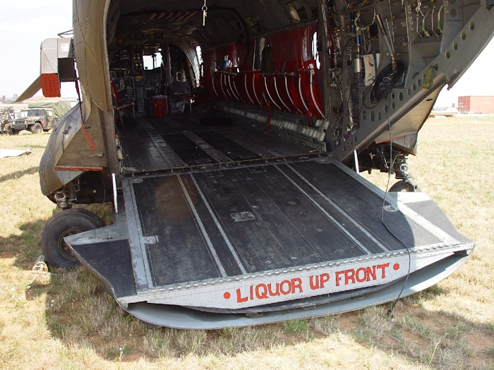 July 2002: Sitting in the grass at Camp Bondsteel, Serbia, this photograph shows 89-00138 in the days following the accident. The writing on the end of the ramp has nothing to do with the accident and should not be construed in such a manner as to cause one to believe that Army aviators drink and fly - they do not. Flight Engineers take a certain amount of liberty in personalizing their aircraft with nose art and other markings as a sense of humor and pride. It's when an accident happens that the use of certain phrases may be the cause of some embarrassment.