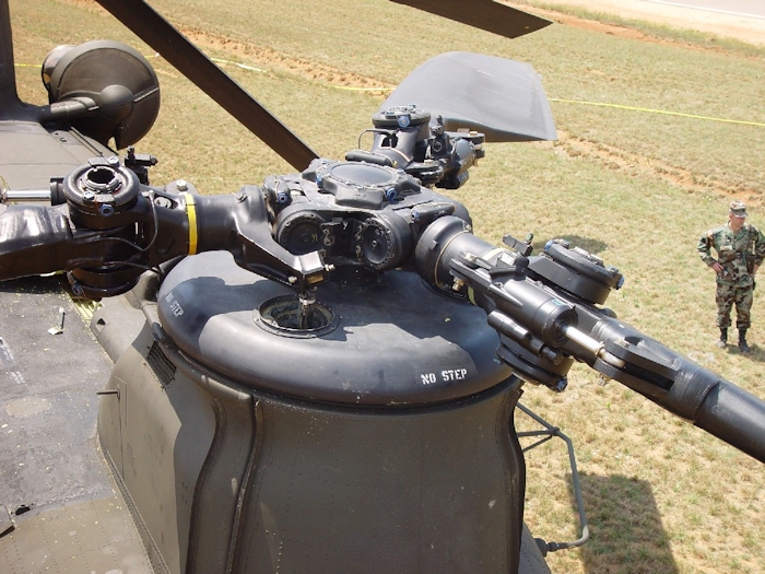 July 2002: The Forward Rotor Head of 89-00138 after the accident. There does not appear to be any damage in this photograph.  However, only a thorough tear-down inspection would reveal any damage. One can see how the rotor blade lead-lag dampner is supposed to be mounted to the blade.