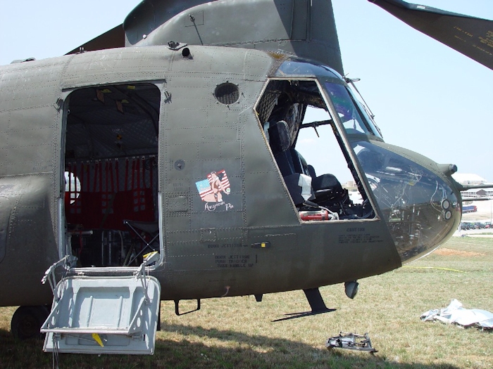 July 2002: The right forward cockpit area of 89-00138. This aircraft had provisions for a rescue winch installed above the main cabin door. The left cockpit door can be seen laying on the ground.