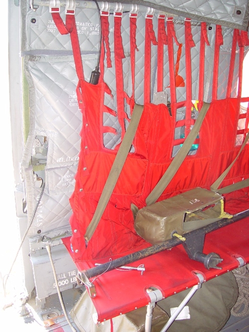 July 2002: The M-24 Machine Gun mount is sitting on the troop seat in the forward cabin next to the main cabin door. When installed for use, the mount will radically impede egress from the helicopter.