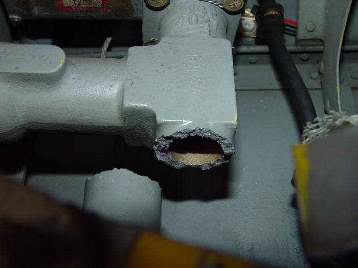 July 2002: An extreme close up view of the fractured fuel fitting.
