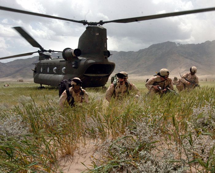 89-00144 and Soldiers from Company A, 3rd Battalion, 141st Infantry Regiment, Texas Army National Guard, practice counterinsurgency tactics near Bagram, Afghanistan.