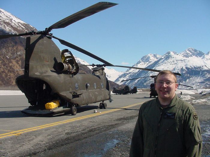 CW2 Gary Brown stands next to broken sister ship 89-00171 at the Valdez airport.