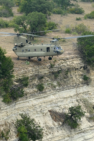 26 August 2010: Hovering with only the rear wheels touching the edge of a cliff, pilots from Company B - "Blackcats", 2nd General Support Aviation Battalion, 227th Aviation Regiment, 1st Air Cavalry Brigade, 1st Cavalry Division, Fort Hood, Texas, perform a maneuver called a pinnacle landing in CH-47F Chinook helicopter 07-08036 during a training flight. The pinnacle allows the pilots to drop off ground forces in areas too dangerous or too difficult to fully land in.