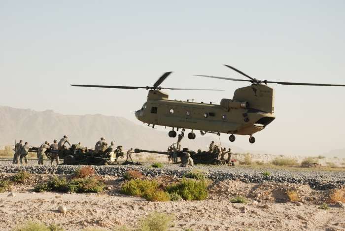 4 August 2009: CH-47F Chinook helicopter 07-08723 and crew prepare to sling load an M777 155mm Howitzer at an unknown location in Afghanistan.