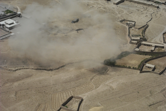 22 June 2009: CH-47F Chinook helicopter 07-08723 creates a huge dust cloud as it hovers at an unknown location in Afghanistan.