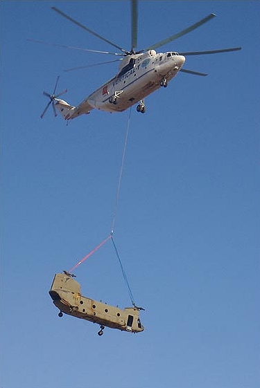 CH-47F Chinook helicopter 08-08042 gets a lift from a MI-26 Halo helicopter in Afghanistan.