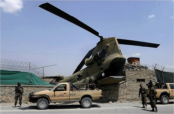 26 July 2010: Afghan National Army (ANA) soldiers stand guard alongside International Security Assistance Force (ISAF) CH-47F Chinook helicopter 08-08048 which crashed in an eastern district of Kabul yesterday. The aircraft made a hard landing along the perimeter of a coalition force camp in Kabul province.