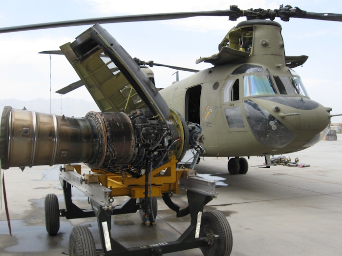 With the Number 2 Engine on a workstand, 08-08056 sits on the ramp outside a hangar in Afghanistan while undergoing phased maintenance. The engine had an oil leak that required its removal, repair and reinstallation.