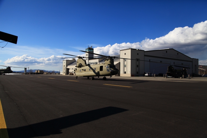 19 April 2012: CH-47F Chinook helicopter 08-08772 taxies past historic Hangar 1 upon its arrival at Ladd field, Fort Wainwright, Alaska.