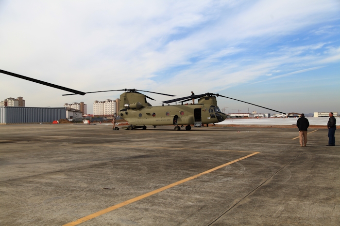 8 November 2013: CH-47F Chinook helicopter 11-08841 parked on the ramp at Desiderio Army Airfield, Camp Humphreys, Republic of Korea. To the rear of the aircraft is Flight Engineer Wade Cothran, on top is Vic Estrada, and over to the right is Tim McCall and Rich Feltzer (in a nice leather jacket).