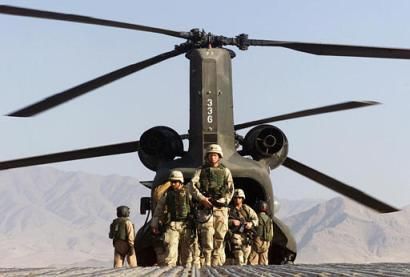 A group of U.S. soldiers disembark from a Chinook CH-47D helicopter after a mission at the U.S. occupied air base in Bagram.