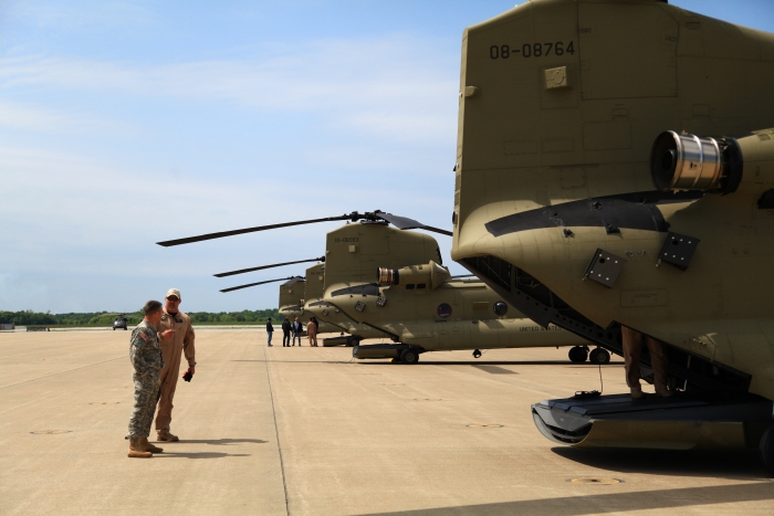 10 April 2012: After refueling at Fort Campbell (KHOP), Kentucky, LTC Brad Killen and Flight Engineer Rob Simpson have a conversation behind 08-08764.