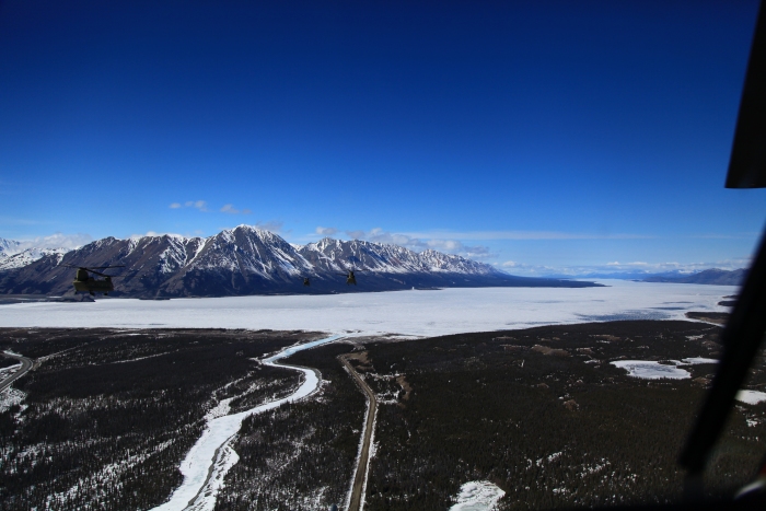 18 April 2012: Sortie 1 passes over Kluane Lake (vicinity N 61° 2' W 138° 20'). The tall peak at 12 o'clock has no name and tops out at 7,811 feet. The ALCAN swings around the south side of the lake and continues on the far side (west side of the lake) from where the flight is presently. Huge cracks can be seen in the ice covering the lake as large chunks begin to break up and slide up and over adjacent layers.