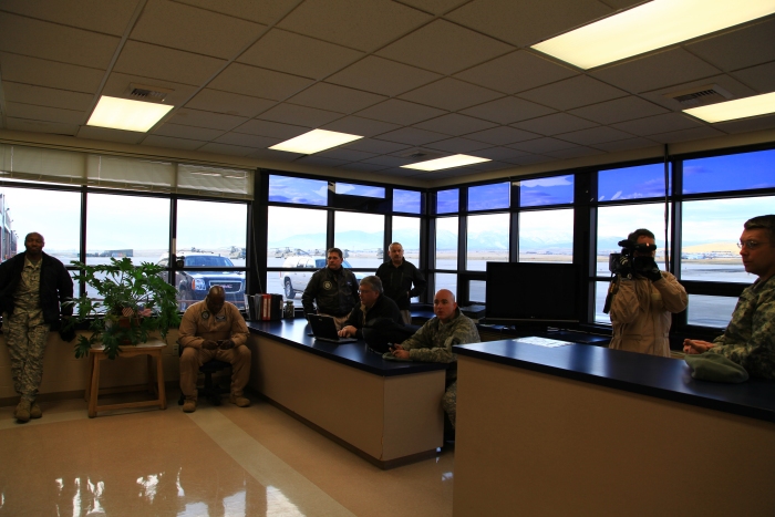 16 April 2012: Pilots discuss the weather situation prior to the flight into Canada in the Operations section of the Army National Guard's facility at Helena.