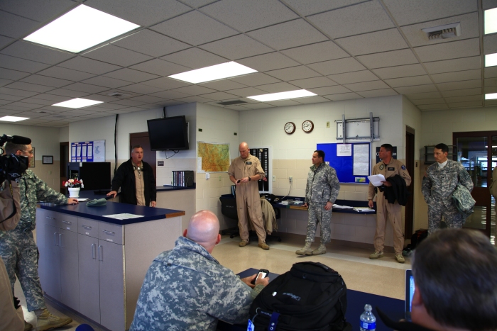 16 April 2012: Pilots discuss the weather situation prior to the flight into Canada in the Operations section of the Army National Guard's facility at Helena. Colonel Bob Marion, H47 Program Manager (on the right in the background) joined the ferry flight team in Helena as copilot on 773 bumping CW3 Ken Hoover.