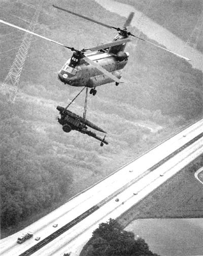A Chinook transporting a Lance missile via sling load.