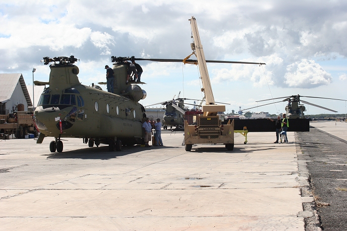 20 November 2010: With two aircraft under going preflight in the background, CH-47F Chinook helicopter 09-08069 is the last aircraft on the dock at Pearl Harbor to get reassembled.