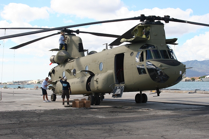 20 November 2010: CH-47F Chinook helicopter 09-08067 gets some final maintenance during reassembly on the dock at Pearl Harbor.