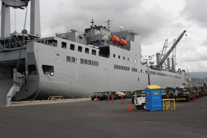 18 November 2010: The USNS Mendonca, a 950 foot long roll-on, roll-off cargo vessel, sits at the dock at US Naval Base Pearl Harbor. Aboard is the newest version of Boeing's famous CH-47 "Chinook" helicopter - the F model. The day's operation began with the unloading of the Cargo Containers (CONEX) from the forward hole. By the end of the day, all 14 helicopters, two flight simulators and several CONEXs were unloaded.