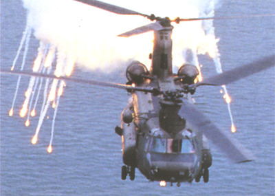 File Photo: Image of an RAF HC-2, a British version of the MH-47 similar to the one shot down on 2 November 2003, deploying decoy flares. The decoy flares confuse the heat seeking capability of the SA-7 series of surface to air missiles. If fired at the right time during the attack, the flares allow the aircraft to escape the threat.