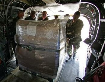 Ohio National Guardsmen unload ice from the cargo hold of a Chinook helicopter after landing in a rural area to assist victims of Hurricane Katrina in Mississippi on Thursday.