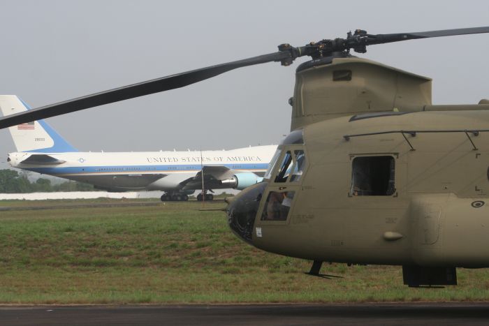 A CH-47F Chinook helicopter stands ready next to Air Force One.