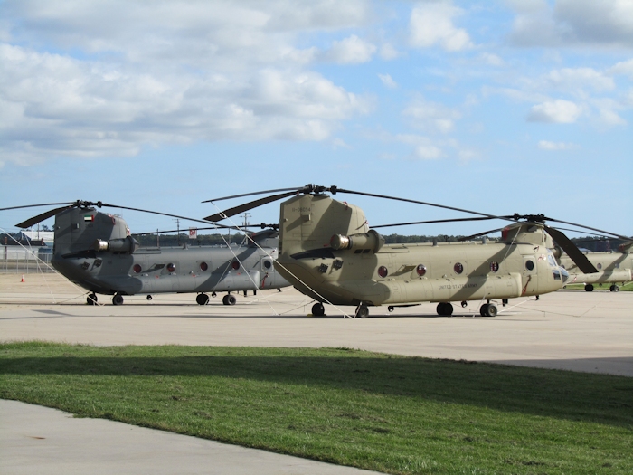 21 September 2012: A United Arab Emirates CH-47F (2501) and US Army CH-47F (11-08094) stand side by side on the ramp at Millville Municipal Airport. The UAE aircraft is essentially the same as the US Army version minus the Blue Force Tracker (BFT) and Improved Data Modem (IDM) systems.