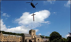 A Chinook helicopter has been used to help erect Britain's largest cross at a monastery in North Yorkshire.