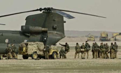 Preparing for a possible declaration of war against Irag, troops train boarding a Chinook helicopter.